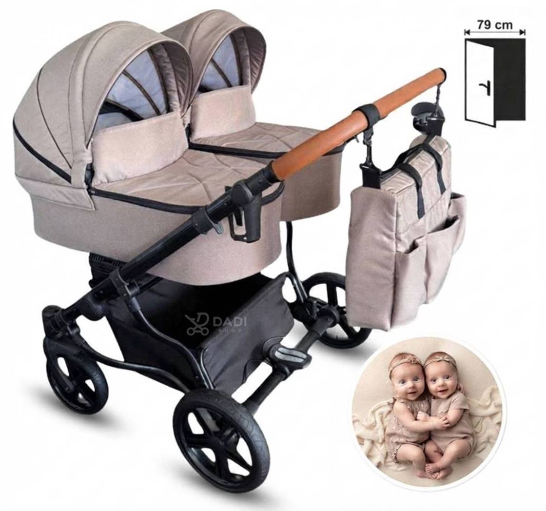 Wózek dla bliźniąt Adbor Duo Lux w kolorze beżowym z torbą, widok z boku. Szerokość 79 cm. W rogu zdjęcie bliźniąt