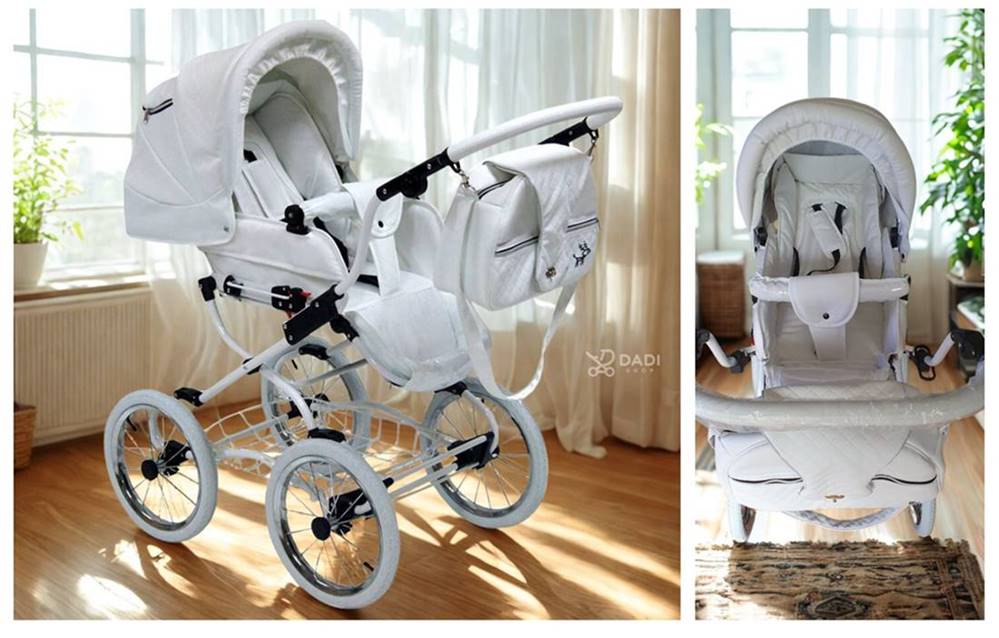 Wózek spacerowy Baby Fashion ISABELL 2w1 w kolorze białym – widok przód i bok, pasy bezpieczeństwa, zdjęcie w pokoju dziennym.