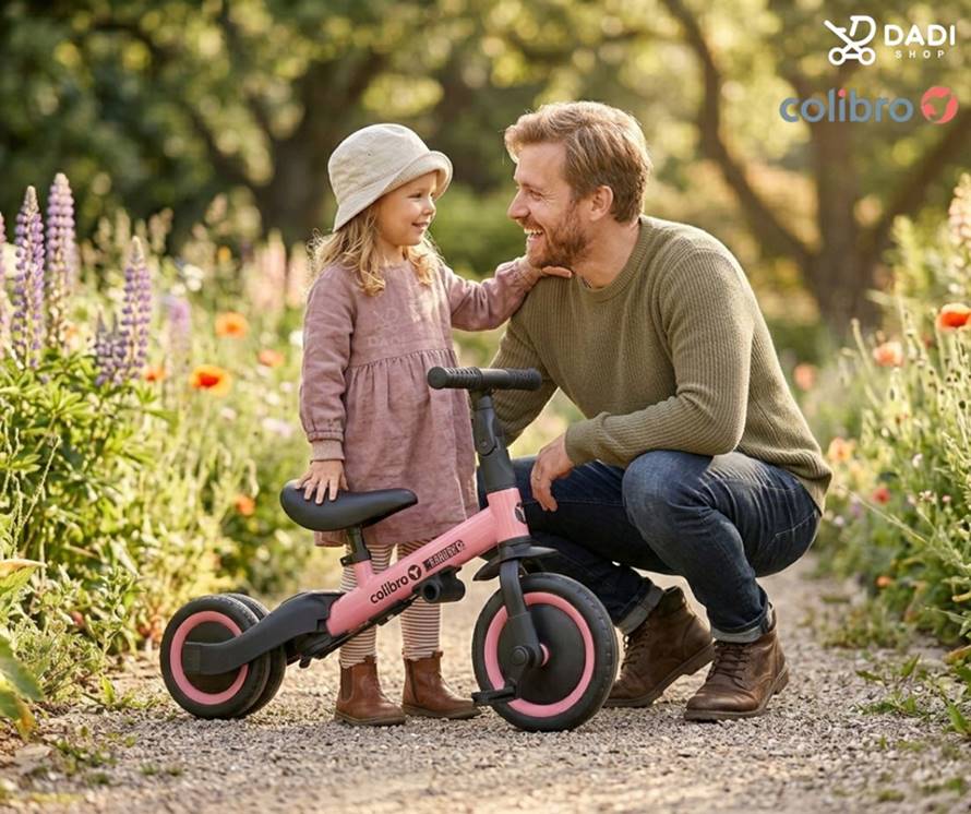 Rowerek Colibro Tremix UP różowy – tata z córką w kwiatowym ogrodzie, nauka jazdy na biegowym rowerku