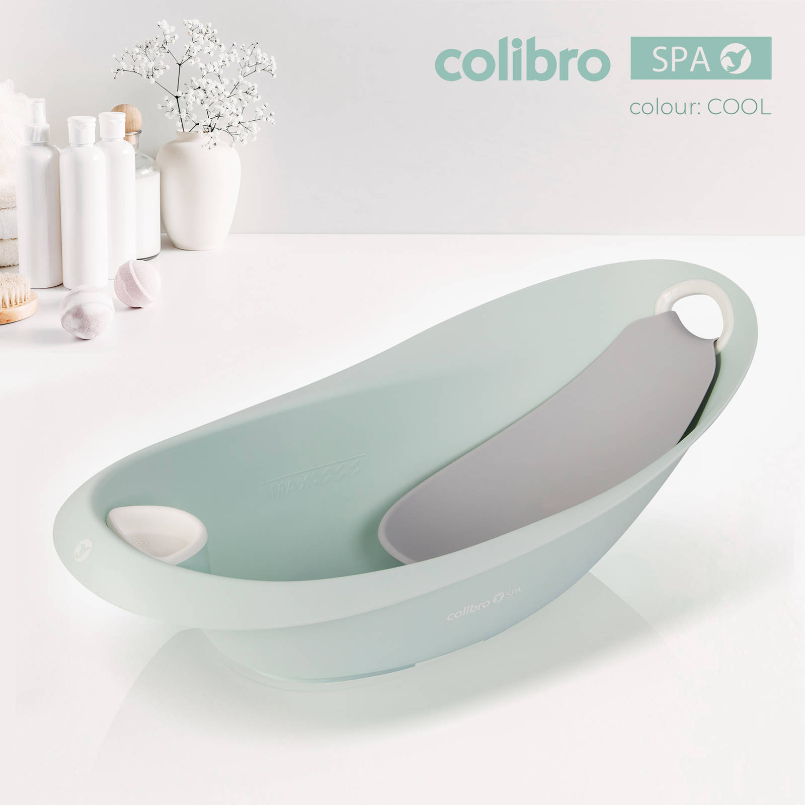 Miętowa wanienka dziecięca Colibro Spa 2w1 w kolorze Cool z wkładką typu leżaczek na białym tle.