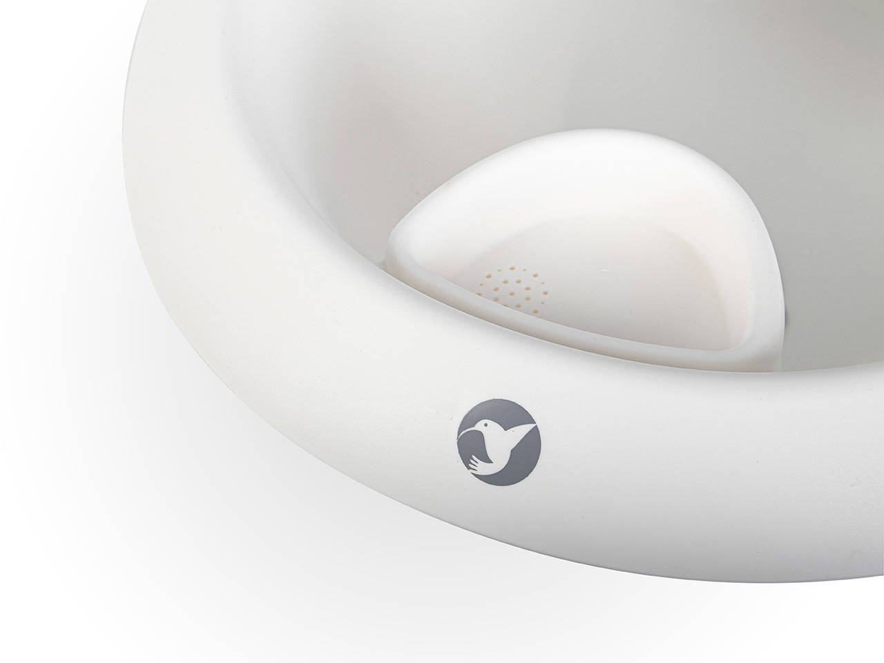 Zintegrowany uchwyt na mydło wewnątrz białej wanienki Colibro Spa z logo marki.