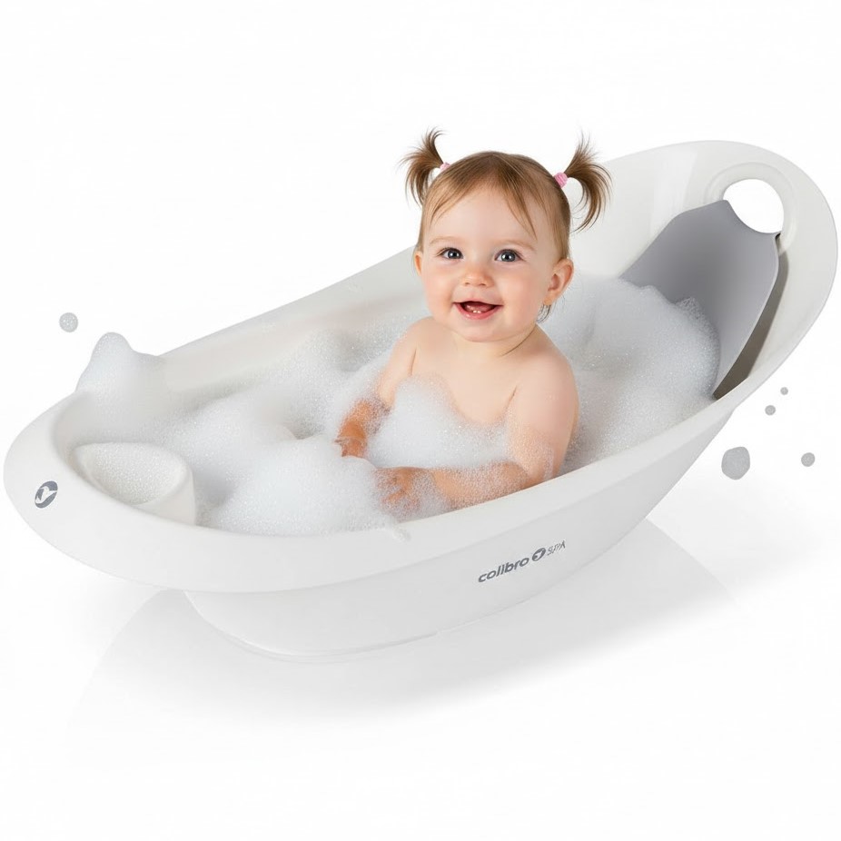 Dziecko siedzi w białej wanience Colibro Spa z leżaczkiem; widoczna piana kąpielowa.