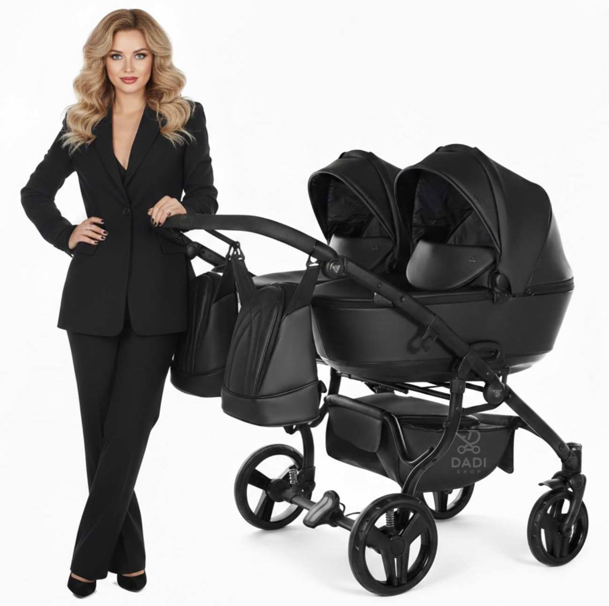 Model presenting the stylish Duo Space Junama double pram crafted from durable black eco-leather.