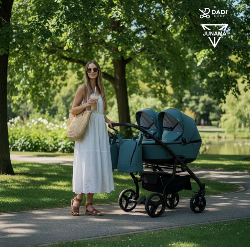 Wózek bliźniaczy Junama Space Duo 03 z dwiema gondolami w wiosennym parku. Szczęśliwa mama.