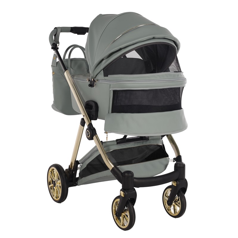 Zielona gondola Junama Ellegante Art Deco 05 z odkrytymi panelami wentylacyjnymi w budce i misie.