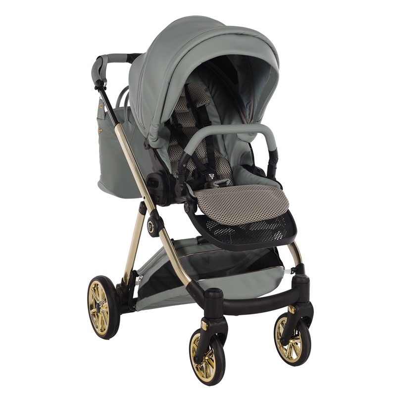 Nowoczesna spacerówka Junama Ellegante Art Deco 05 Green na złotym stelażu z torbą pielęgnacyjną.