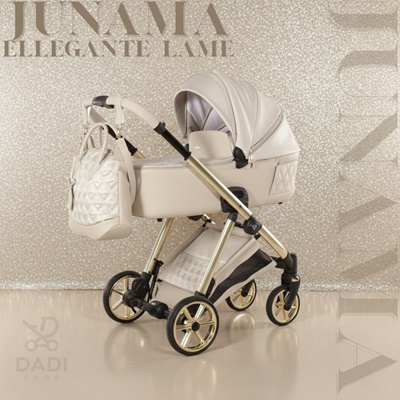 Wózek dziecięcy Junama Ellegante Lame 02 Beige 4w1. Kremowa gondola i siedzisko na złotym stelażu, z torbą, na tle brokatowym. Elegancki design.