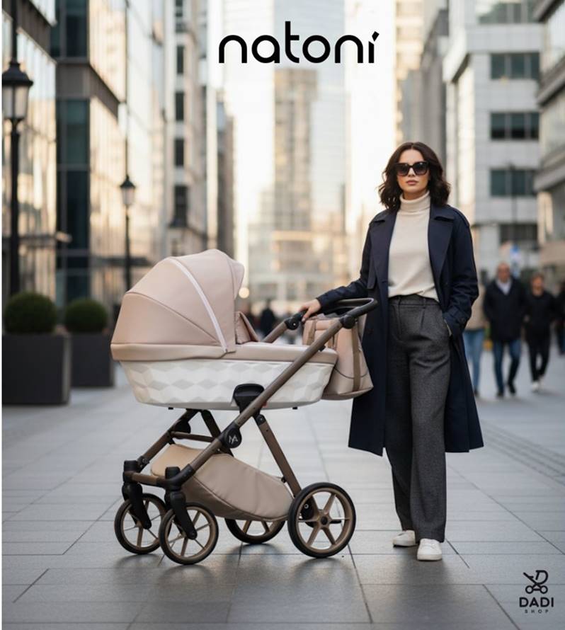 Fashionable street style photo: a woman in a navy coat and sunglasses with a beige Natoni Baby Abis stroller in a modern city setting, emphasizing sleek design and urban elegance.
