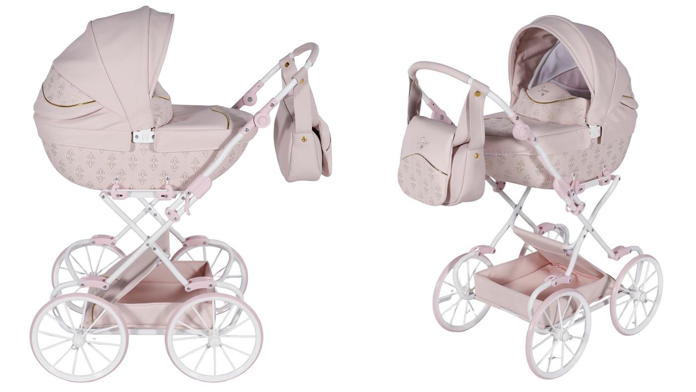 Junama Art Deco Mini – retro wózek dla lalek w pudrowym różu z ekoskórą, torbą i dużymi klasycznymi kołami.