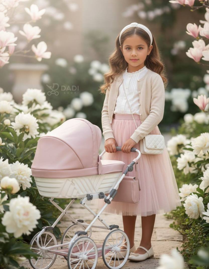 Girl with retro dolls stroller Kunert Rossie in pink and white eco leather during park session. Dadi-shop